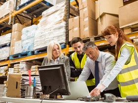 Warehouse workers working together at warehouse 