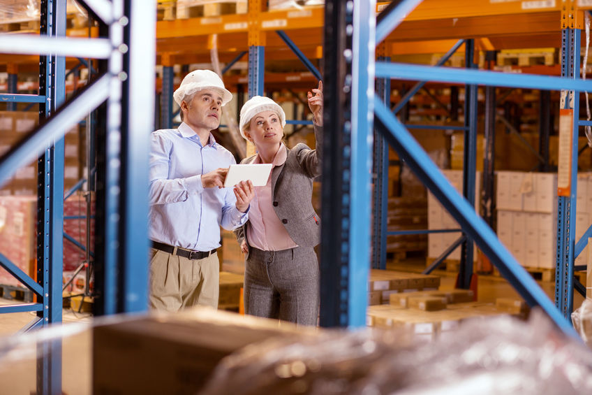 Two Warehouse colleagues standing together