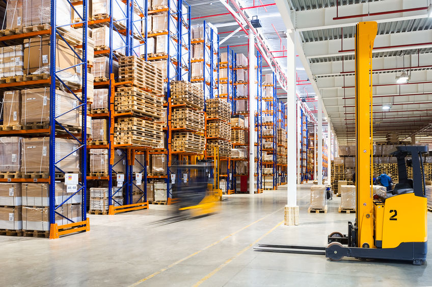 Large modern warehouse with forklifts