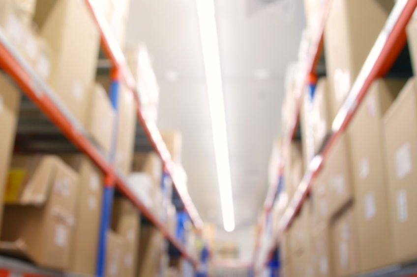 Blurred clothing and retail warehouse background with bright lights