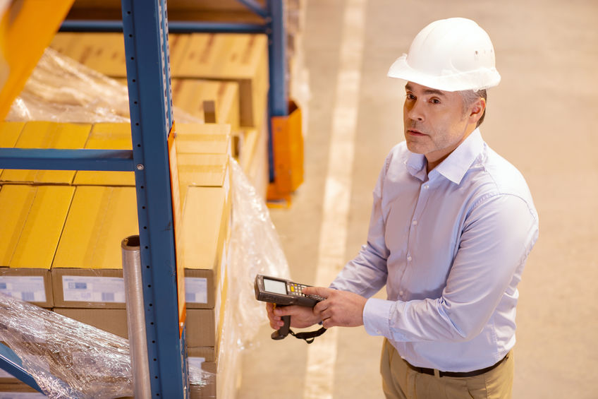 Worker in contract warehouse finishing order