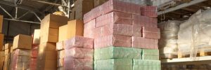 Paper products stacked on warehouse shelf